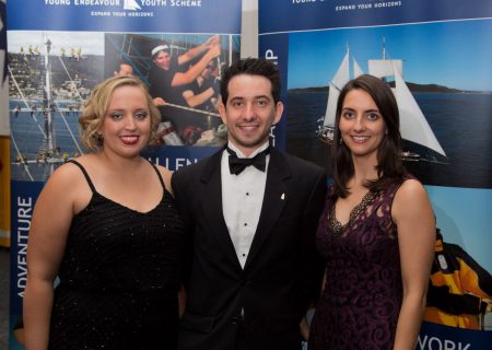 (From left) Fiona Herbert, Stuart Bryson and Caitlin Stephenson, members of the Young Endeavour youth crew for the 2015 World Voyage at the Young Endeavour 2015 World Voyage Gala, held aboard HMAS Adelaide, Fleet Base East. *** Local Caption *** Guests celebrated the completion of STS Young Endeavour's circumnavigation of the world at a gala dinner held aboard HMAS Adelaide at Fleet Base 
East, Sydney.

More than 200 young Australians sailed the square-rigged tall ship during the 12-month World Voyage, for voyages between 18 and 60 days duration. They crossed the Pacific, Atlantic and Indian Oceans, the Mediterranean and the North Seas, and the English Channel.

Learning to sail under the guidance of the Royal Australian Navy crew, they sailed the Roaring Forties and the Furious Fifties, rounded Cape Horn and the Cape of Good and raced in the 2015 Tall Ship Races. Two crews participated in the Centenary of Anzac commemorations at Anzac Cove on the Gallipoli Peninsula.

They visited 17 countries during the 12-month voyage from Sydney, around the world to Fremantle. After visiting Western Australia, South Australia Tasmania and Victoria, STS Young Endeavour sailed through Sydney Heads to complete their circumnavigation on 17 March 2016.

The World Voyage crew join more than 12,000 youth who have completed the internationally recognised Young Endeavour Youth Development Program under the guidance of specially trained Royal Australian Navy crew since STS Young Endeavour was gifted to Australia in 1988. A further 10,000 guests from organisations supporting youth with special needs have joined the community day sails in ports around Australia.

The Young Endeavour Youth Scheme continues to provide young Australians aged 16-23 with a unique, challenging and inspirational experience at sea aboard STS Young Endeavour. Corporate and community support ensures the Young Endeavour Youth Scheme and the Royal Australian navy can provide the opportunities to a diverse range of Young Australians, now and into the future.